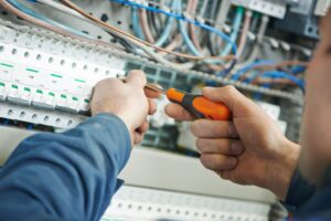 Technician fixing a Furnace that Won't Turn On 