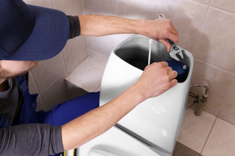 Plumber Repairing Leaky Toilet in Frederick MD