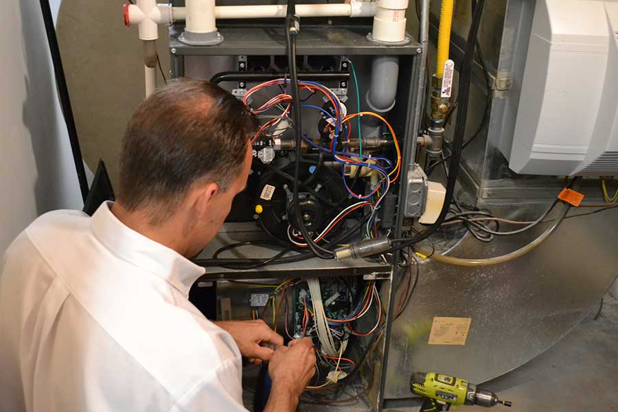 Larry & Sons technician performing electrical services.