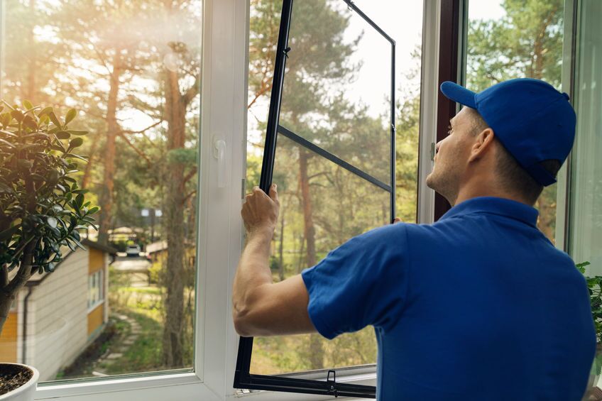 A technician installing a window