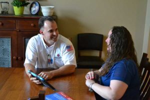 Larry and Sons Technician Talking with Customer